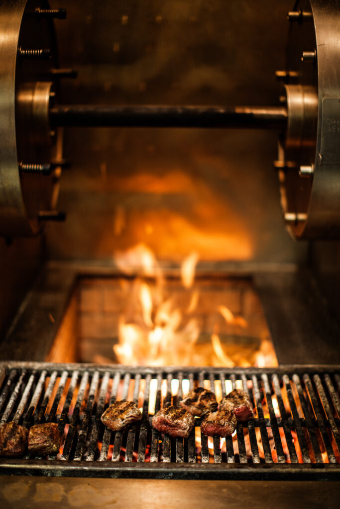 Engage your guests at the Chef’s Table, watching our chefs at our live wood-fired grill.